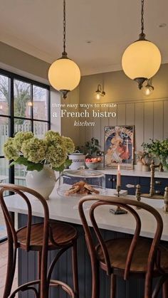 an image of a kitchen setting with flowers in vases on the counter and chairs