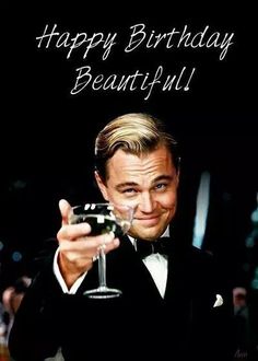 a man in a tuxedo holding a wine glass with the words happy birthday beautiful