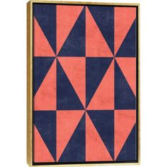 an orange, blue and pink geometric pattern framed in wooden frame on white wall background