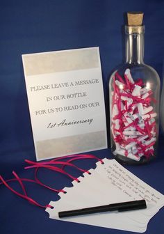 a message in a bottle next to some red string and other items on a table