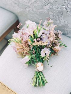 a bouquet of flowers sitting on top of a chair