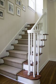 there is a set of stairs with carpet on the bottom and second handrails