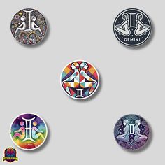 four different colored badges with designs on them