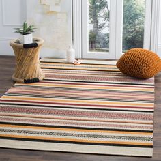 The Montauk Rug Collection captures the essence of casual designer style. The breezy, coastal character of these flat weave rugs complements decor from contemporary to country to city loft. Montauk area rugs are made using 100% pure, soft cotton for remarkable clarity of color, and are hand woven to create classic Ikat tie-dye effects. Safavieh Montauk Bronte 3 X 5 (ft) Red Indoor Stripe Coastal Throw Rug Cotton | MTK211A-3 Coastal Area Rugs, Safavieh Rug, Rugs And Mats, Cotton Area Rug, Flat Weave Rug, Cotton Rug, Indoor Area Rugs, Online Home Decor Stores, Throw Rugs