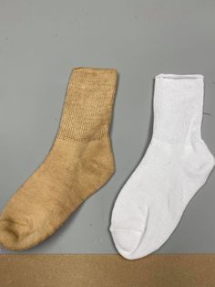 two pairs of socks sitting next to each other