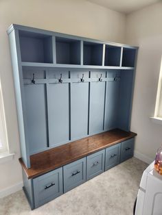 a room that has some blue cabinets in it