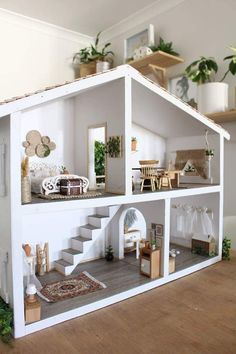 a doll house with furniture and plants in it