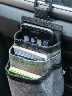 a cell phone is in the pocket of a car