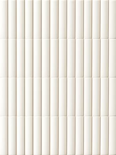 a white tile wall with vertical lines on it