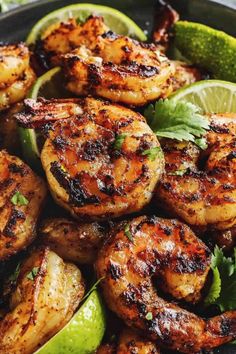 grilled shrimp and limes in a skillet