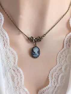 "This elegant grey-blue cameo necklace features an intricate floral connector combined with a lovely grey-blue vintage lady portrait cameo. Makes a lovely keepsake gift for a Bride (think \"something blue...), bridesmaids, or even a special present for a Victorian jewelry lover. SIZE: The cameo pendant (not including the floral connector) measures approximately 20mm x 15mm (the actual cameo is 18mm x 13mm). The chain is cable style and available in 16\" or 18\" lengths. You can choose your prefe Vintage Blue Jewelry, Vintage Cameo Necklace, Vintage Necklace Pendant, Vintage Necklace Victorian, Broaches Vintage, Vintage Necklace Aesthetic, Victorian Jewelry Necklace, 1800s Jewelry, Vintage Cameo Jewelry