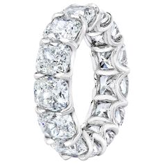 a white gold ring with diamonds on the inside and outside, set in 18k white gold