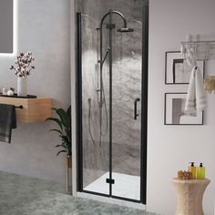 Modern and refined, the Frameless Pivot Door collection offers your bathroom a very glamorous look. It uses tempered glass and is SGCC certified to ensure safe use and installation. The sturdy and corrosion-resistant stainless steel handle intensifies its timeless stylish look. Our Shower Doors offer an adjustable distance of 20 mm on each sides to accommodate different wall spacing. The versatile installation of either the right-or-left hand door opens to meet your operating habits. The glass is covered with an Easy Clean coating treatment, which can repel water, soap scum, and dirt. This helps to reduce the cleaning time by up to 90%, turning the current alcove into an elegant shower destination. WELLFOR EX Small Bifold Shower Door Black 34-in to 35-1/2-in W x 72-in H Frameless Bifold Sh Shower Door Black, Bifold Shower Door, Door Black, Door Detail, Pivot Doors, Door Seals, One Piece Toilets, Dream House Interior, Shower Door