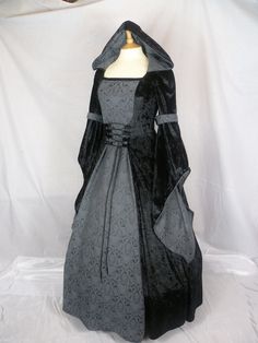 This is for a custom made dress,it will be made to the measurements you send me. Please send me your bust,waist and hip measurement,and please measure from the top of your shoulder to the floor with shoes on. It will be made with beautiful black crushed velvet and stunning grey and black jacquard  .It will have a corset style front and back with black lacing so you can adjust the dress to fit your body shape. Combined shipping on multiple items. If you purchase express shipping by courier please send me your phone number thank you. Wedding Dress Gothic, Medieval Wedding Dress, Gothic Gowns, Custom Made Dress, Dark Green Dress, Made Dress, Medieval Dress, Hooded Dress, Gothic Dress