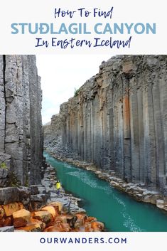 the blue water is flowing between two large rocks and there are text overlay that reads how to find stulagi canyon in eastern iceland