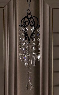 a chandelier hanging from the side of a door