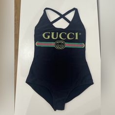 Gucci Brand New Women’s One Piece Bathing Suit Never Worn , With Tags Gucci Logo Size : Xs Made In Italy Gucci Women's Swimwear For Summer, Gucci Bodysuit, Gucci Bathing Suit, Gucci One Piece Swimsuit, Gucci Cotton Tops With Logo Print, Gucci Brand, Gucci Logo, One Piece Bathing Suit, Gucci Black