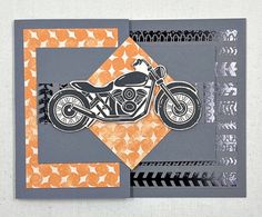 an orange and gray card with a motorcycle on it