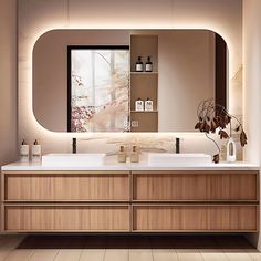 a bathroom with a large mirror above the sink and two vases on the counter