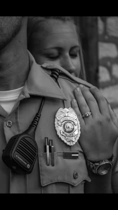 a police officer is holding the hand of a woman