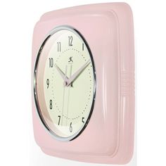 a pink clock with white hands and numbers on the face is shown against a white background