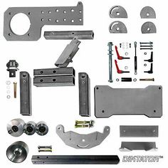 an assortment of metal parts and hardware on a white background