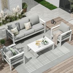 an aerial view of a patio with white furniture