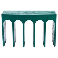 a green wooden table with metal legs