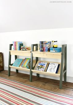 two wooden bookshelves sitting next to each other on top of a carpeted floor