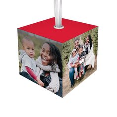 a photo cube ornament with two photos on it and a white toothbrush holder