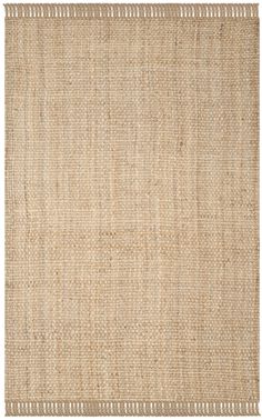 a beige rug with fringes on it