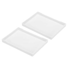 two white trays sitting next to each other