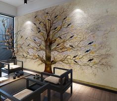 a living room with a large tree painted on the wall