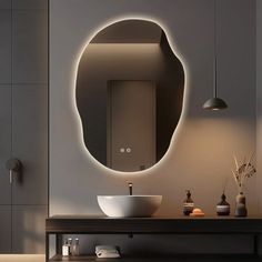 a bathroom with a sink, mirror and lights on the wall above it is shown