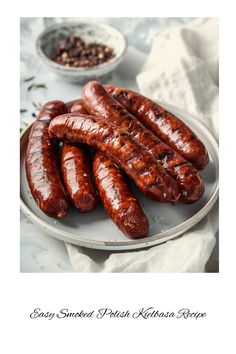 several sausages are on a plate next to some beans