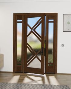 an empty room with two doors and a rug in front of the door that has glass panels on it