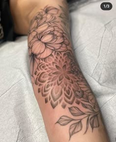 a person with a flower tattoo on their arm