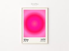 a pink poster hanging on the wall in front of a white wall with an orange circle