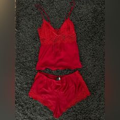 Never Worn With Tags Still Attached! Gorgeous Red 2-Piece Sleep Set From Victoria’s Secret. Non-Stretch Material. Adjustable Straps On The Top To Tighten Or Loosen. 3 Buttons On The Back Of The Top To Open Up The Back. The Shorts Have An Elastic Waistband To Stretch To Your Hips. I Always Wash And Clean Clothes Before Shipping Them Out To Their New Home Red V-neck Loungewear Set, Red Lounging Sets For Summer, Red Summer Sets For Bedtime, Red Bedtime Sets For Summer, Red Camisole Sleepwear For Loungewear, Red Camisole Sleepwear For Night, Red Summer Sleepwear For Night, Red Lace Trim Sleepwear For Summer, Red Camisole Sleepwear For Bedtime