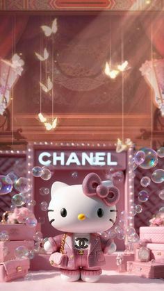 a hello kitty doll is standing in front of a chandelier with lots of bubbles