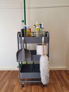 a mop and cleaning supplies on a cart