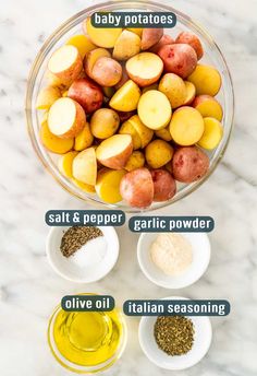 the ingredients to make baby potatoes are shown in bowls on a white marble countertop