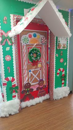 a christmas door decorated with gingerbreads and candy canes