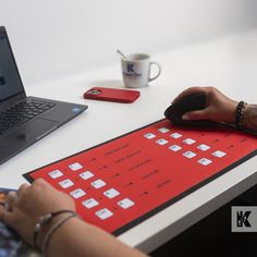 a person sitting at a desk with a laptop and mouse