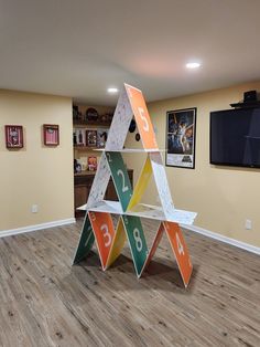 a room with wooden floors and an upside down shelf