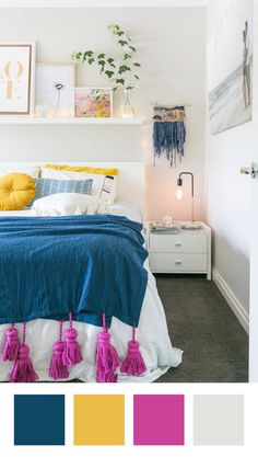 a bedroom with a bed, nightstands and pictures on the wall above it that have tassels hanging from them