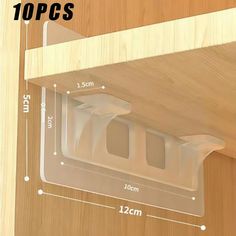 an image of a wooden shelf with clear plastic over it and measurements for the top