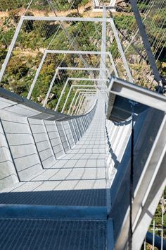 a man riding a skateboard down a metal walkway