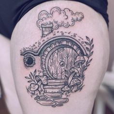 a woman's thigh with an image of a hobbot door on it