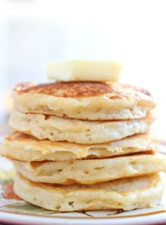 a stack of pancakes with butter on top